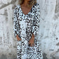 Vestido fluido estampado con cuello en V y bolsillos