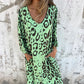Vestido fluido estampado con cuello en V y bolsillos