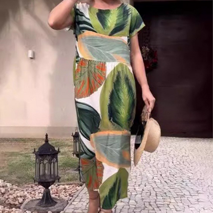 Damenkleid mit Blattdruck, Rundhalsausschnitt, Seitenschlitz und kurzen Ärmeln